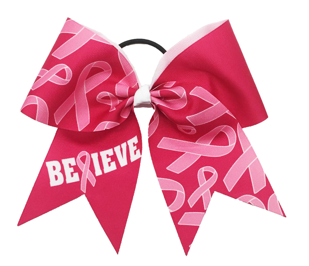 Pink and white cheer bow with 'BELIEVE' and breast cancer awareness ribbons on a white background