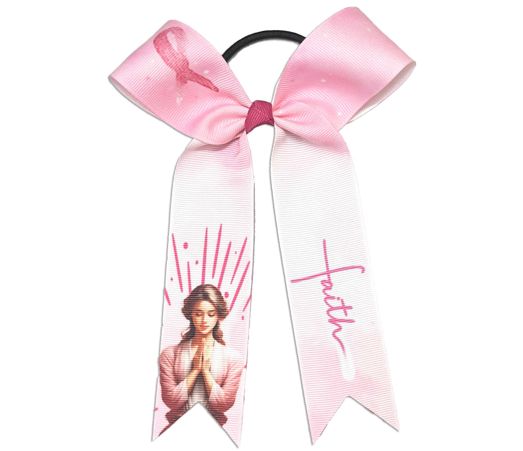 Pink and white collegiate sized cheer hair bow with a prayers design, breast cancer ribbon loop and the word 'Faith' in a cross on a white background