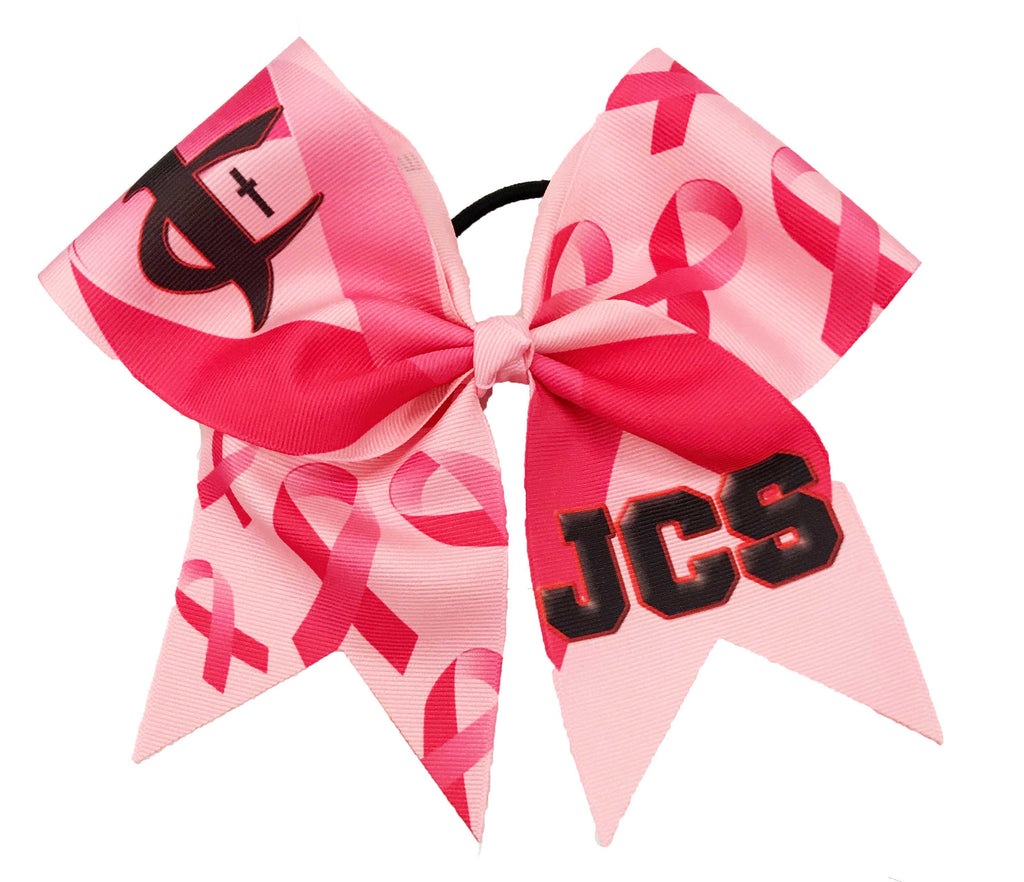 Pink breast cancer awareness bow with 'JCS' letters on a white background