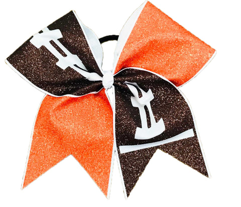 Cheerleading bow with orangeand brown football design on a white background