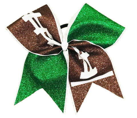 Glittery emerald green and brown cheer bow with white football design on a white background