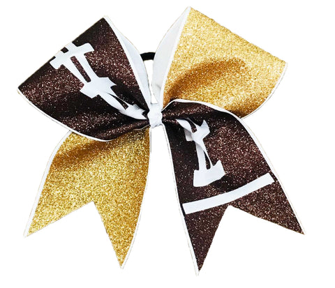 Glittery cheer bow with gold, brown football, and white colors on a white background