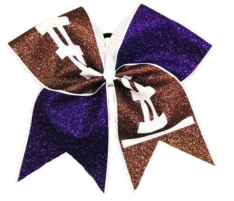 Glittery cheer bow with purple and brown football design on a white background