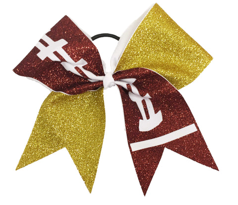 Glittery brown footaball and yellow gold cheer bow on a white background