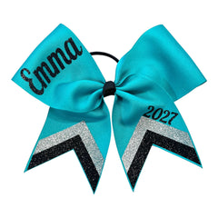 Personalized teal cheer bow with black glitter name Emma on one loop and 2027 on the other, featuring black and silver glitter chevron stripes on a white backround