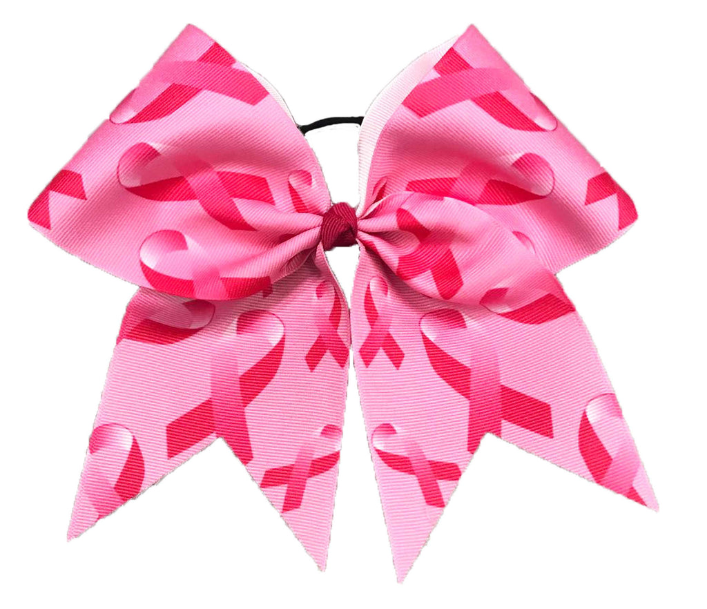 Pink breast cancer awareness ribbon patterned hair bow on a white background