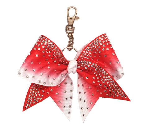 Red to white ombre bow keychain with rhinestones on a white background
