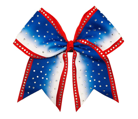 Red, white, and royal blue ombre cheer bow with silver rhinestones on a white background