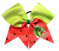 A watermelon-themed hair bow with a large lime green top loop and two red lower loops printed with watermelon seeds and a cartoon watermelon graphic, attached to a black elastic band on a white background.
