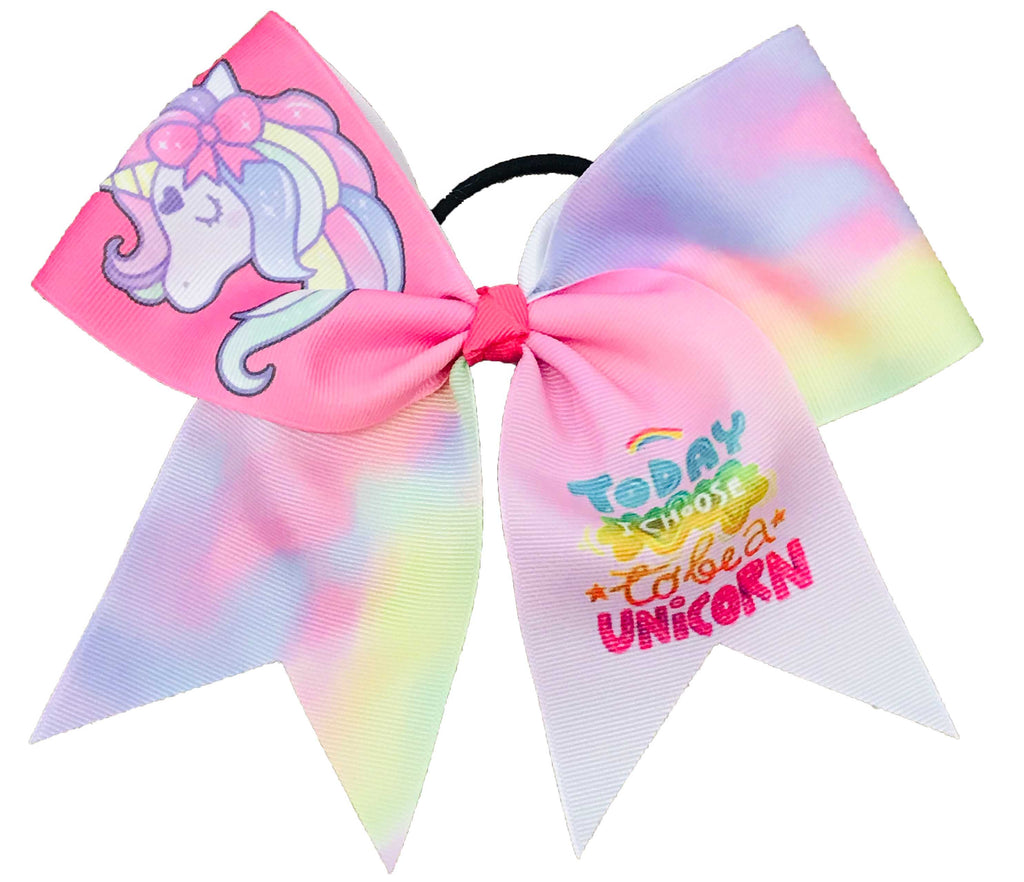 Colorful pastel pink bow with unicorn design and text on a white background