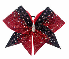Red and black gradient glitter competition cheer bow covered in black, red, and iridescent AB rhinestones on white background.