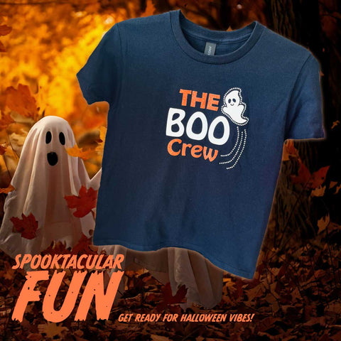 Black t-shirt with 'The Boo Crew' design on a Halloween-themed background with ghosts and leaves.