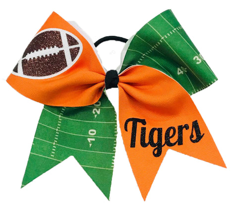 Bow with football design and 'Tigers' text on a green and orange background