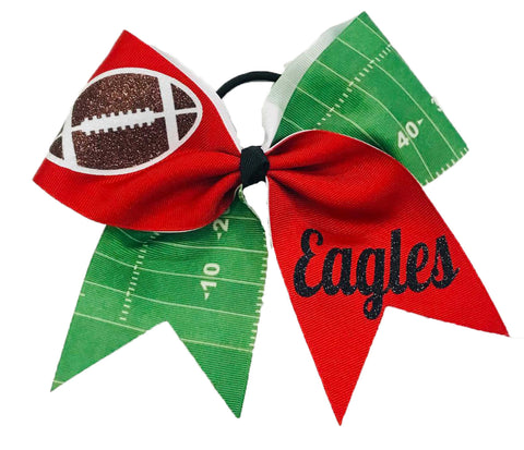 red Bow with football design and 'Eagles' text on a green field background