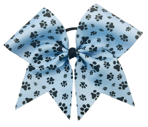 Blue bow with black paw prints on a white background