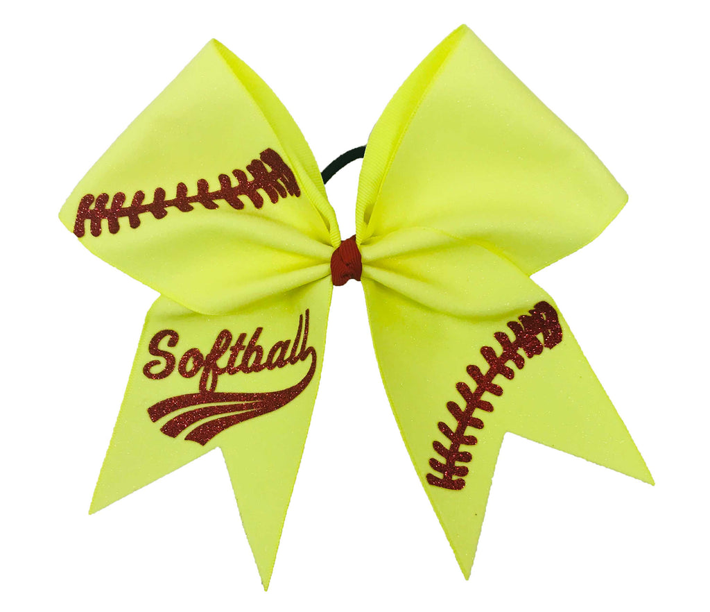 Yellow hair bow with 'Softball' text and stitching details on a white background