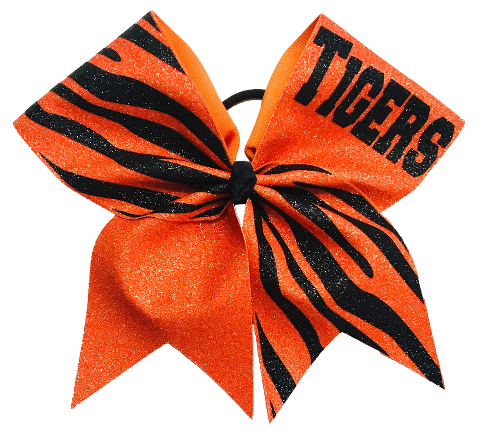 Orange and black striped glitter cheer bow with 'TIGERS' text on a white background