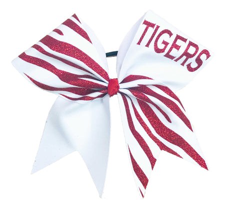 Red and white striped glitter bow with 'TIGERS' text on a white background
