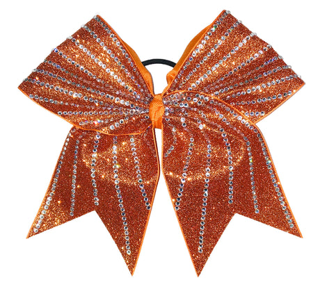 Orange glittery bow with rhinestones on a white background