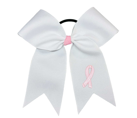 White bow with a pink breast cancer  ribbon on a white background