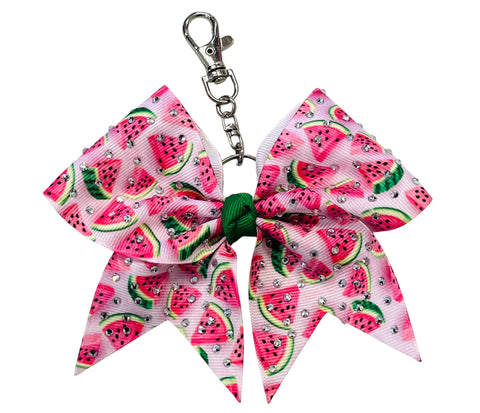 A pink and white watermelon-patterned ribbon cheerleader bow keychain with a green center and silver clasp, shown on a plain white background.