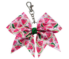 A pink and white watermelon-patterned ribbon cheerleader bow keychain with a green center and silver clasp, shown on a plain white background.