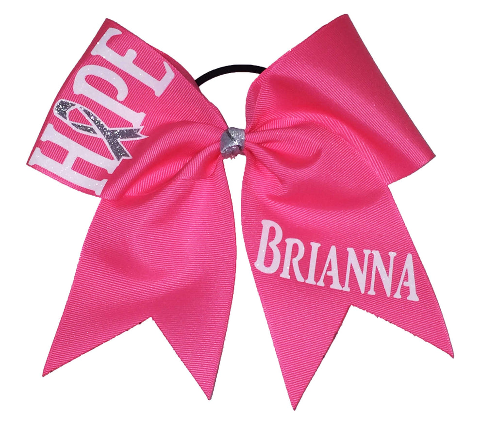 Pink hair bow with 'HOPE' and  personalized with 'BRIANNA' text on a white background