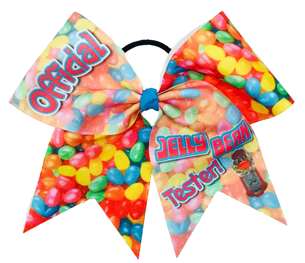 Colorful jelly bean-themed hair bow with 'Official Jelly Bean Tester' text on a white background