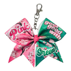 Pink goes good with Green Glitter keychain bow wicked theme on a white background