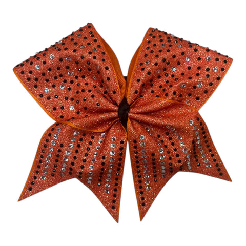 Orange glittery bow with black and clear rhinestones on a white background