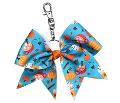Bow keychain with Pumpkin Spice-themed design on a white background