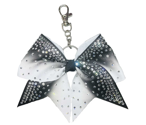 Black and white ombre bow keychain with rhinestones on a white background