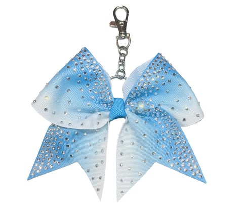 Turquoise Blue to white ombre bow keychain with rhinestones on a white background