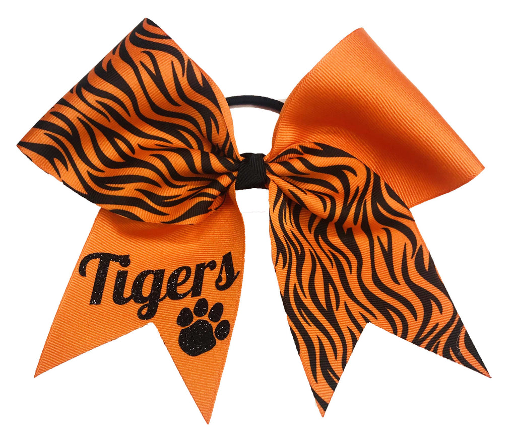 Orange and black striped bow with 'Tigers' text and paw print on a white background