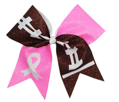 Glittery pink and brown hair bow with breat cancer ribbon design on a white background