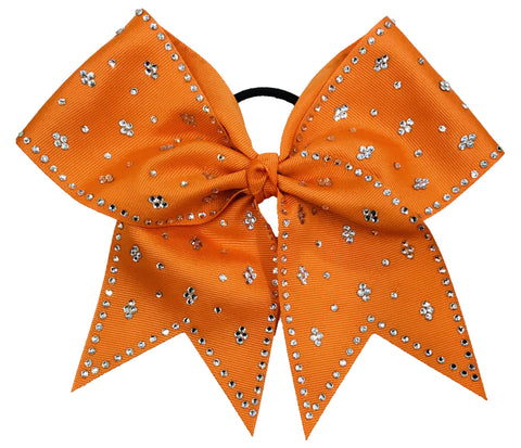 Orange bow with rhinestones on a white background