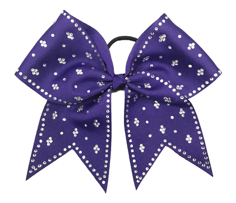 Purple bow with silver rhinestones on a white background