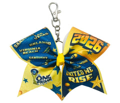 The ONE Prime Finals special event keychain bow in navy and gold with a white background