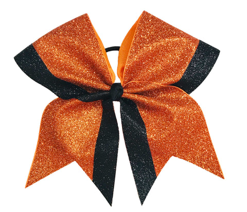 Orange and black glittery bow on a white background