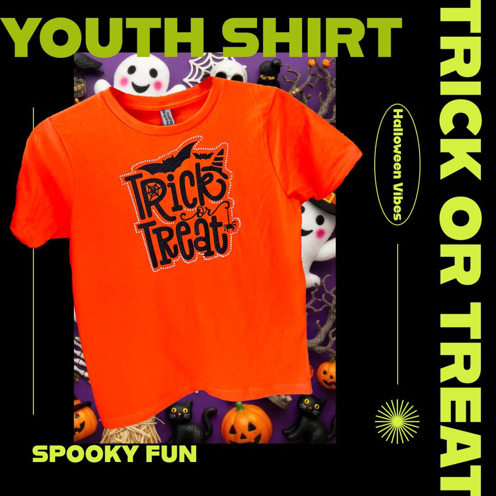 Orange 'Trick or Treat' glitter and rhinestone youth shirt with Halloween-themed background